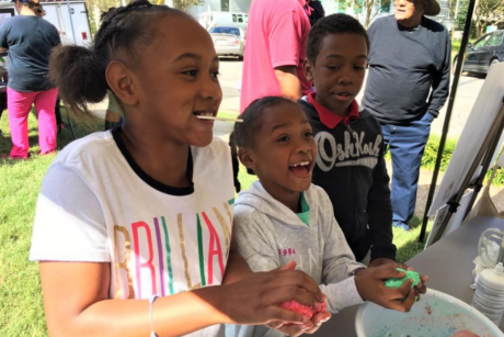 Children making slime at the downtown Warrenton Harvest Market festival