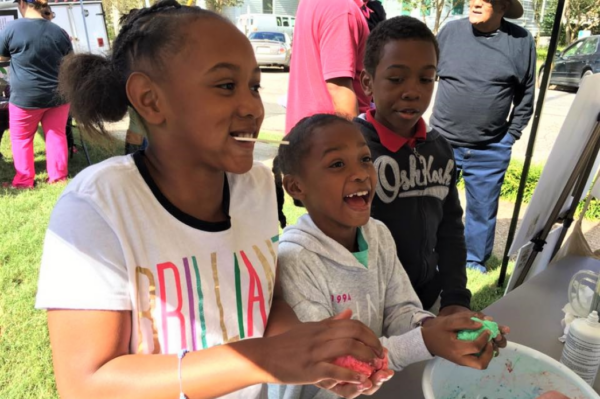 Children making slime at the downtown Warrenton Harvest Market festival