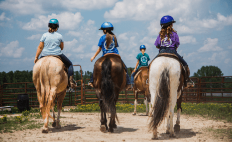 Young folks attend riding lessons at Rockin' E Ranch