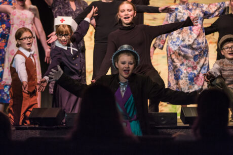 Youth perform a show at local cultural arts center